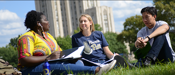 Student sitting on lawn